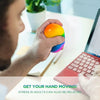 A hand holds a brightly colored, translucent stress ball with multiple colors, demonstrating a sensory fidget toy.