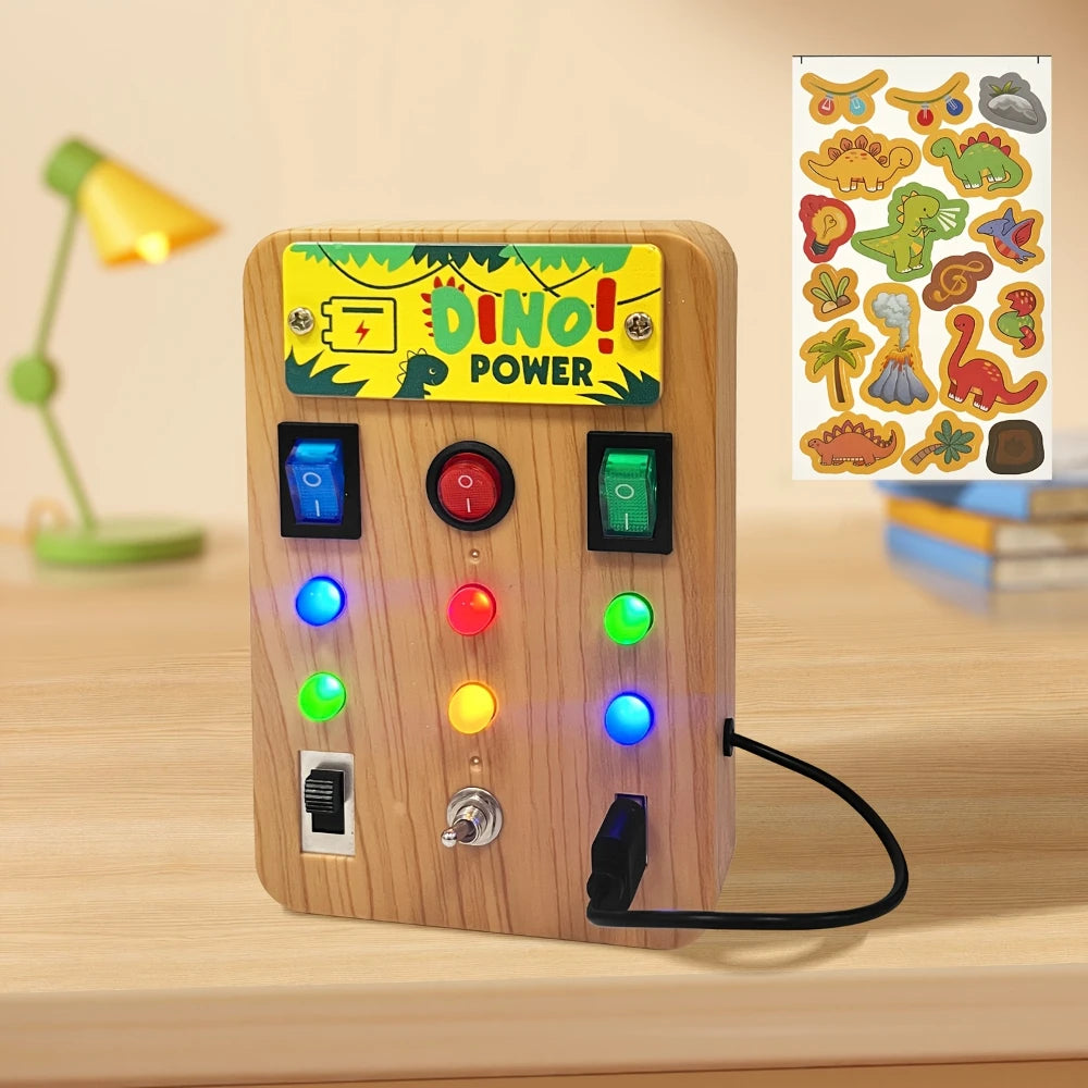 A wooden LED light-up busy board featuring dinosaur graphics and various colored buttons for toddlers.
