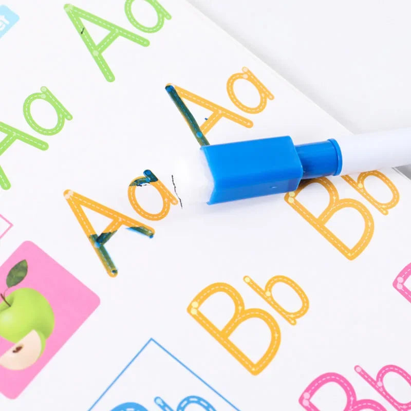 A white marker is tracing large yellow and blue letters on a colorful workbook page.