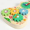 A wooden busy board featuring colorful gears and musical elements for Montessori activities.