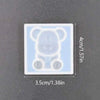 A clear silicone mold shaped like a bear for resin jewelry and crafts.