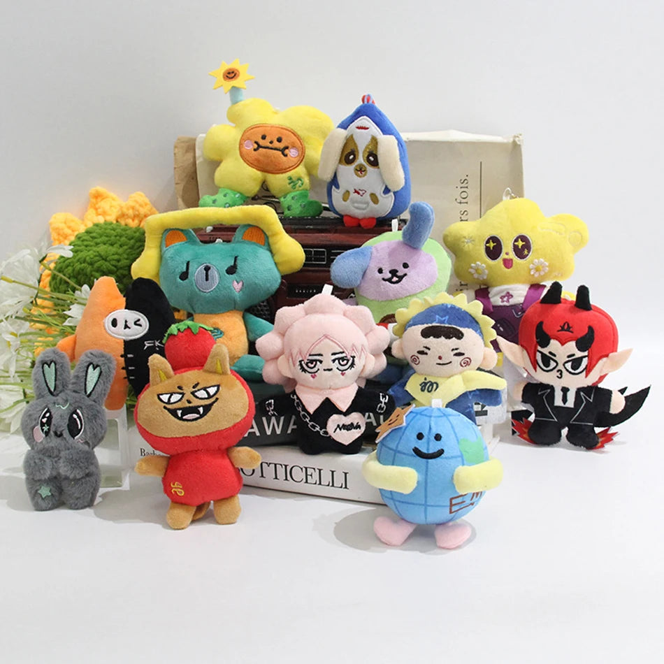 A collection of plush pendant dolls featuring characters from GMMTV celebrity couples in various colors and poses.