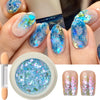 A set of iridescent opal and mermaid chrome nail glitter pigments shown on fingernails and in a jar.