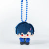 A small, dark blue plush charm with black hair and red accents, hanging from a blue beaded chain.
