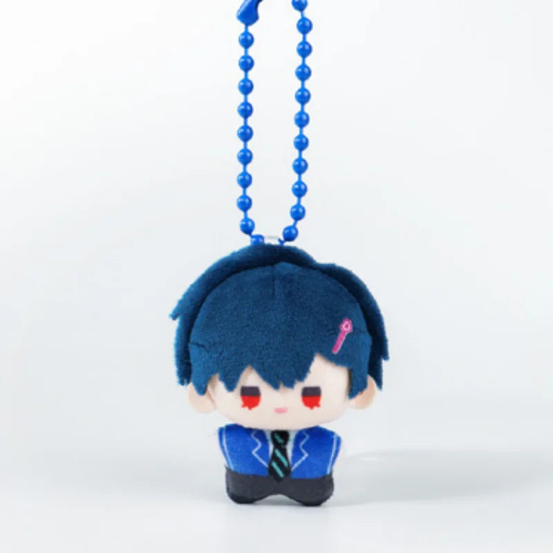 A small, dark blue plush charm with black hair and red accents, hanging from a blue beaded chain.