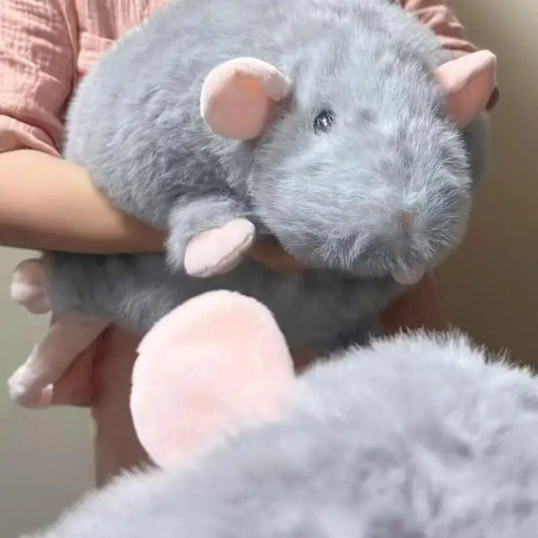 A soft gray plush rat stuffed animal being held by a person's hands.