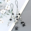 Anime-inspired keychain featuring a black character charm and silver beads on a white background.