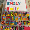A box of magnetic alphabet spelling letters in various colors and shapes for kids