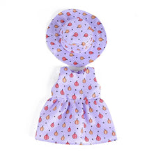 A purple floral dress and sun hat set for dolls featuring small red and white patterned designs.
