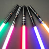 A collection of black lightsabers with glowing blades and colorful lights arranged diagonally against a dark gray background.