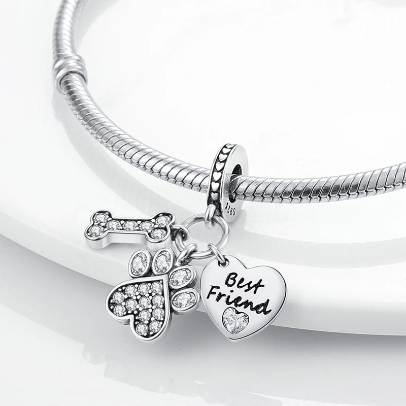 A sterling silver charm bracelet with a heart pendant engraved with the words Best Friend