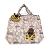 A light beige fabric tote bag featuring a pattern of small yellow and brown hippo-like characters.