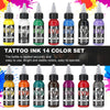 A set of fourteen colored tattoo inks in glass bottles displayed against a white background.