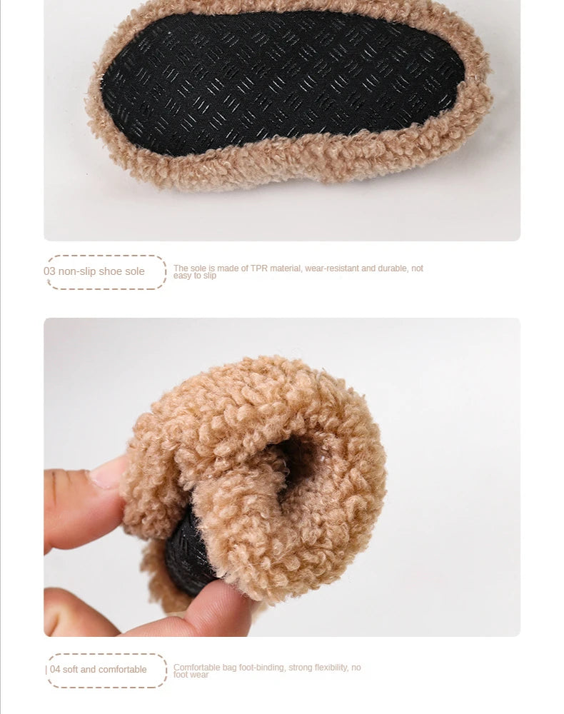A pair of cozy plush baby slippers with a black anti-slip sole and a light brown fuzzy lining.
