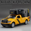A yellow alloy pickup truck RV model with a black trailer on a gray background.