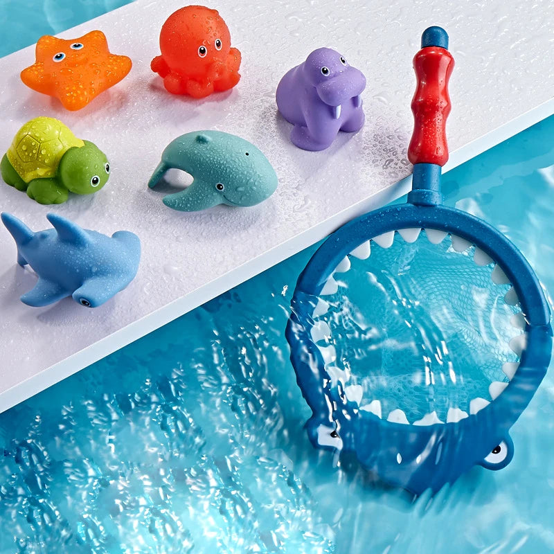 A colorful water-squirting turtle bath toy with a fishing net is shown floating in blue water.