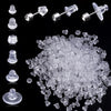 A collection of clear silicone earring backs in various stud and post styles, shown individually and in bulk.