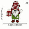 A festive cartoon character iron-on patch depicting a man with a red Santa hat, white beard, and green outfit.
