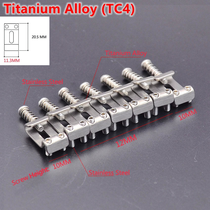 A set of titanium alloy guitar bridge saddles and mounting hardware for electric guitars.