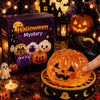 An orange Halloween pumpkin stress relief toy is held in a wooden tray surrounded by spooky decorations.
