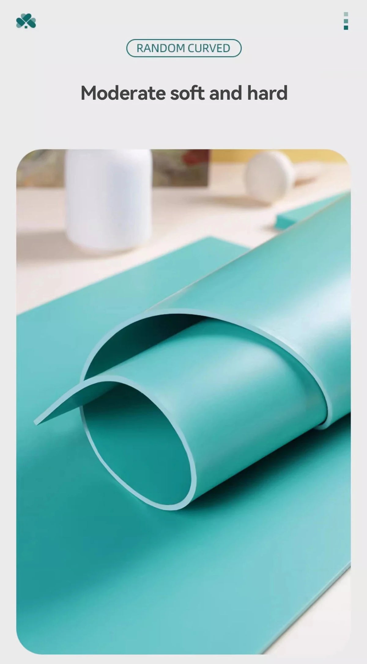 A teal rubber block is shown rolled and partially cut on a light blue surface.