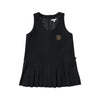 A black sleeveless dress with pleats and a pocket on the chest, part of a cozy knit sweater and pants set.