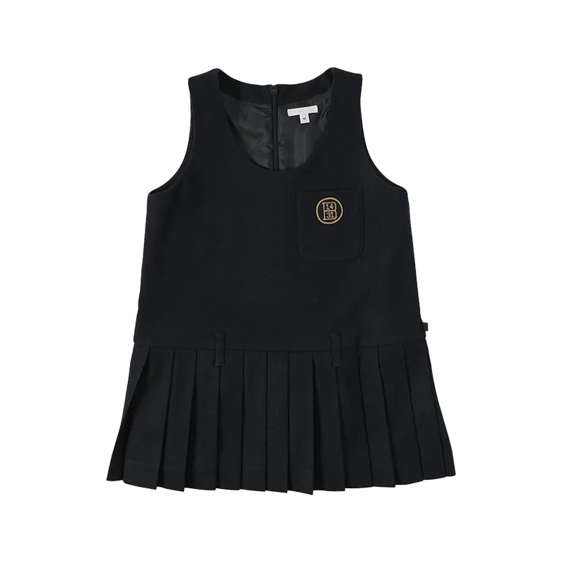 A black sleeveless dress with pleats and a pocket on the chest, part of a cozy knit sweater and pants set.