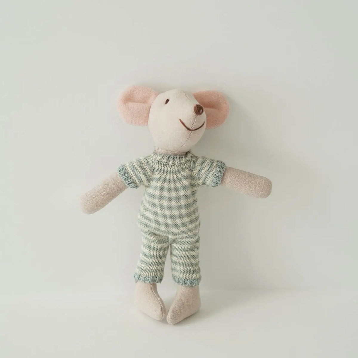 A handmade mouse plush doll with pink ears and a striped green and white outfit.