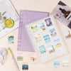 A collection of decorative stickers featuring mountain and sea scenery on a white page surrounded by purple and beige station