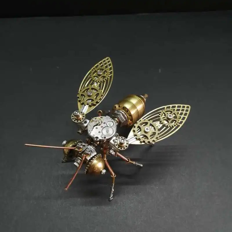 A detailed steampunk mechanical bee model kit featuring brass and silver metal parts.