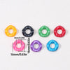 A collection of colorful acrylic beads in various colors including yellow, black, green, red, pink, purple, and blue.