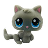 A cute, gray cat bobble head figurine with large blue eyes and pink nose.