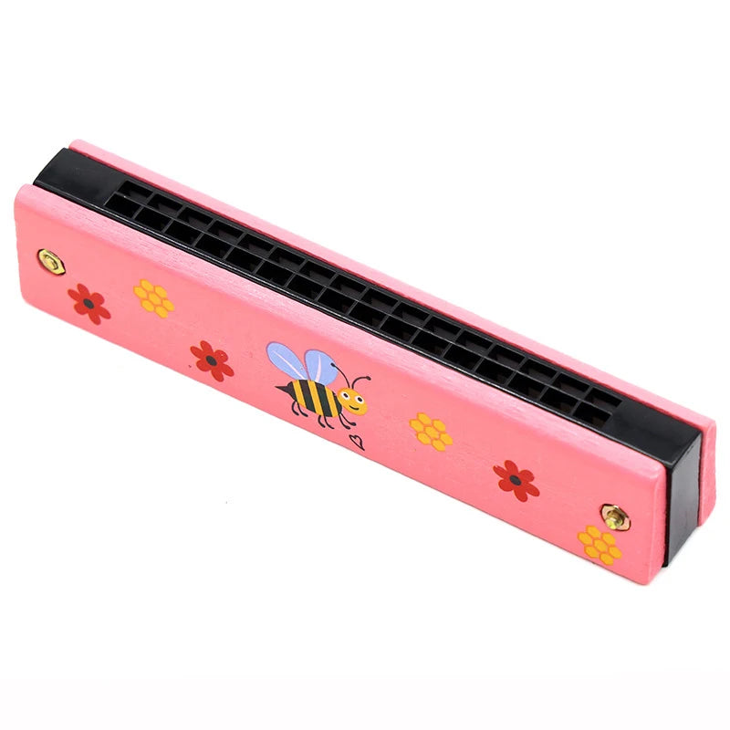 Pink wooden harmonica with a cartoon bee design and black reeds