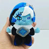 A soft blue and black plush pendant of a collectible doll with white hair and blue accents is held in a hand.