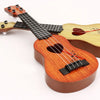 A wooden ukulele toy with a neck and body is shown, featuring adjustable tuning pegs.