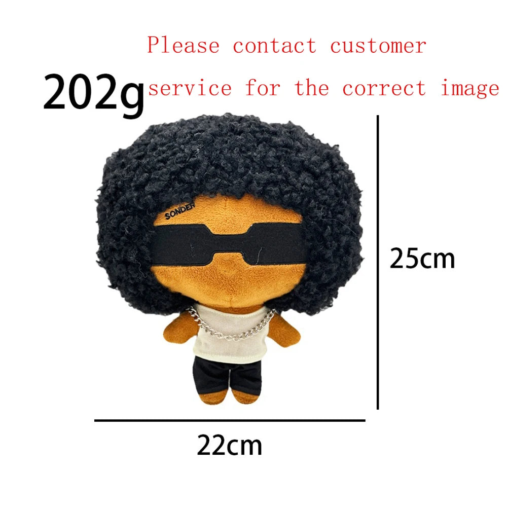 A plush doll resembling Eminem, XXXTentacion, and Frank Ocean with dark curly hair and black sunglasses.