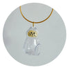 A clear, dog-shaped pet hair keepsake charm suspended from a gold-colored chain.