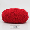 A ball of bright red pre-dyed milk cotton yarn used for knitting and crochet.