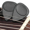 A pair of black guitar picks with anti-slip grips and a 1.5mm thickness resting on a wooden guitar fretboard.