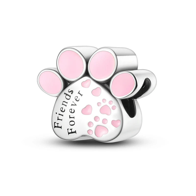 A silver heart charm bead featuring a paw print design with pink accents.