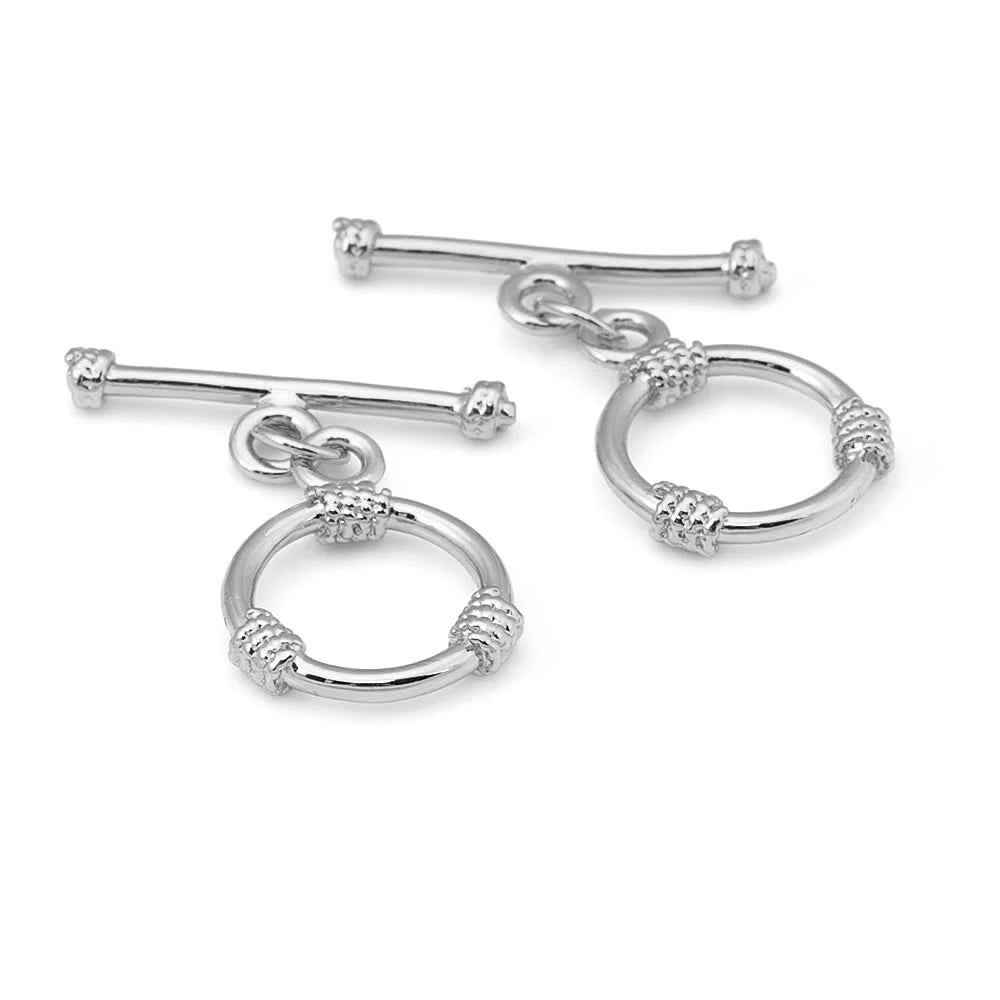 A pair of 18K gold round O-toggle clasps for bracelets and jewelry making.