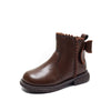 Brown leather ankle boots for girls featuring a bow-knot detail and side zipper.