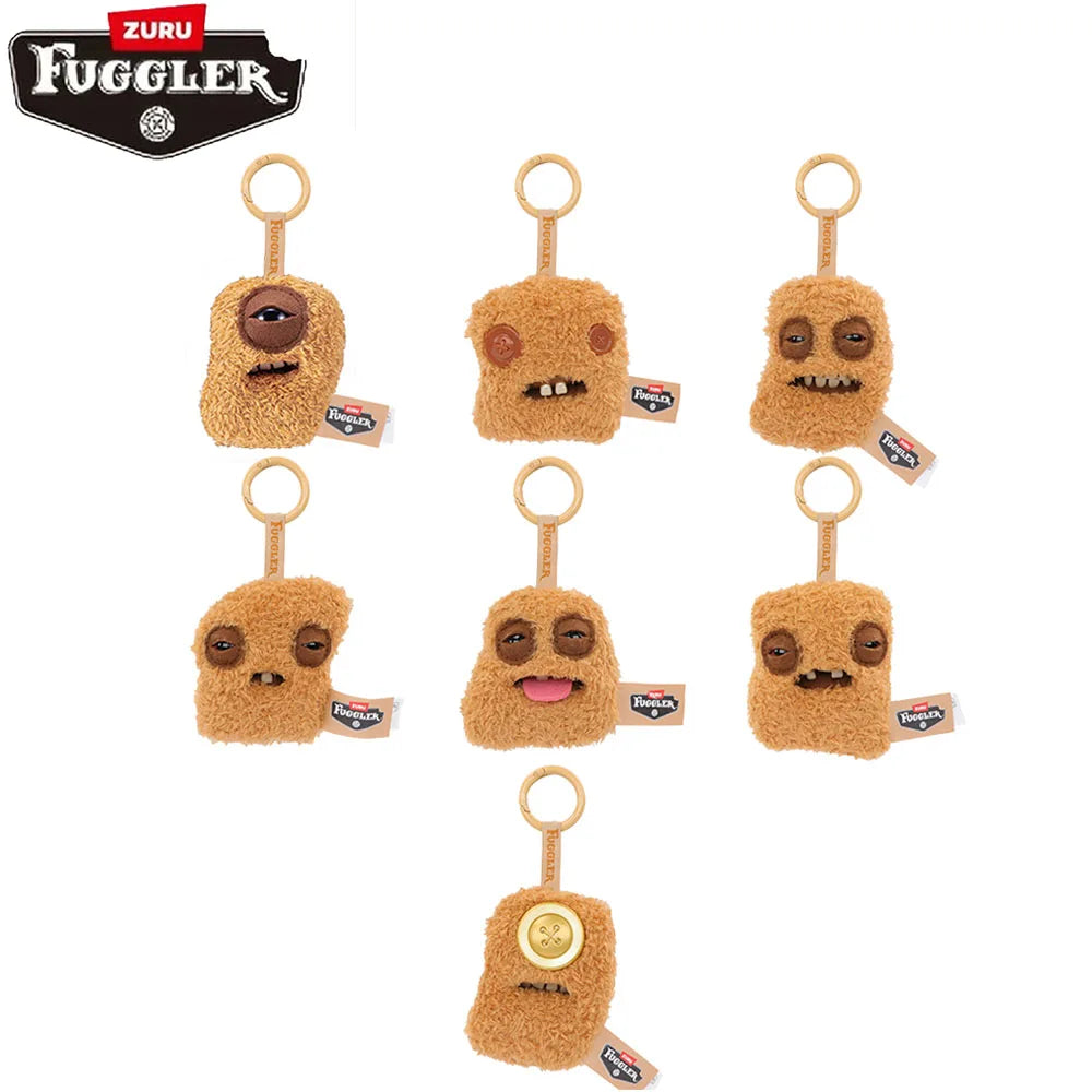 A collection of brown, fuzzy Fuggler nuggets plush keychains hanging from loops.