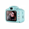 A light blue kids mini digital camera with a selfie lens is shown against a white background.