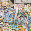 A collection of cute cartoon stickers for journaling and crafting displayed on a surface.