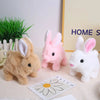 Three plush rabbit toys in shades of brown pink and white displayed on a light surface.