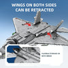 A close-up of a gray fighter jet model kit showing wings that can be retracted on both sides.