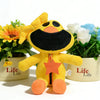 A yellow and black plush doll of CatNap with a star detail sits in front of potted flowers.