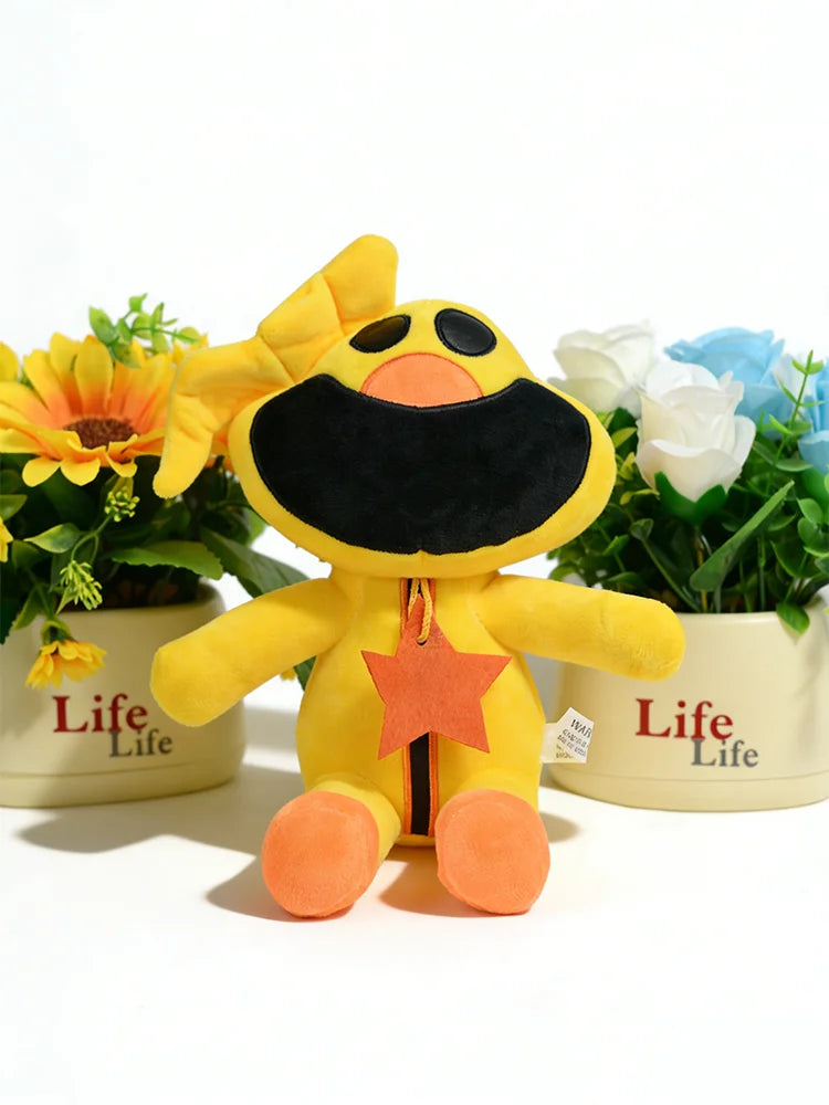 A yellow and black plush doll of CatNap with a star detail sits in front of potted flowers.