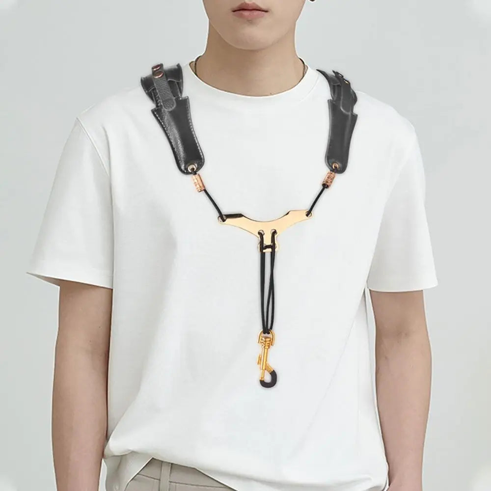 A white t-shirt featuring an adjustable PU leather saxophone shoulder strap accessory.